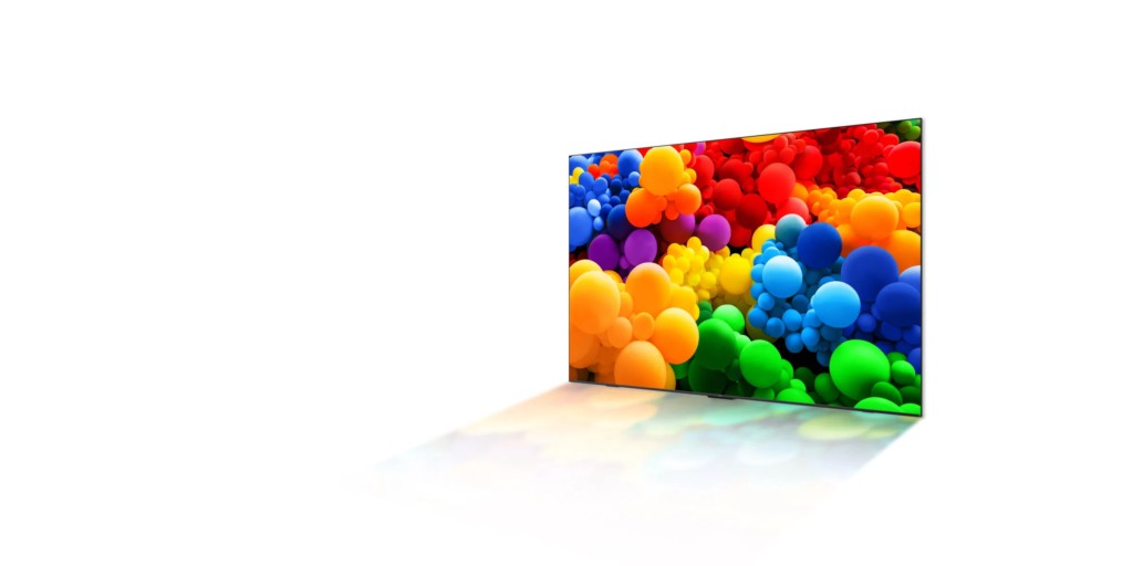image – TCL East Africa Kenya Flat-screen TV on a white background displaying a vivid abstract rainbow of colorful bubble-like spheres edge-on view.