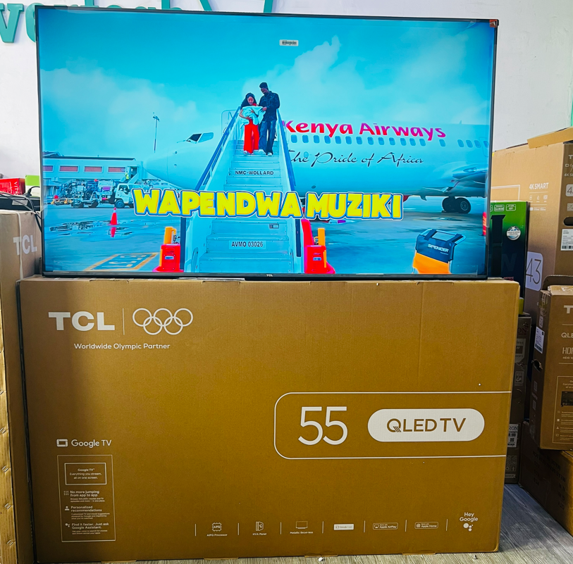 tcl 55t6d photo in kenya – TCL East Africa Kenya 55-inch LED TV on a store display showing a Kenya Airways boarding scene with the bold yellow text 'WAPENDWA MUZIKI'